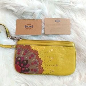Fossil yellow floral wristlet.